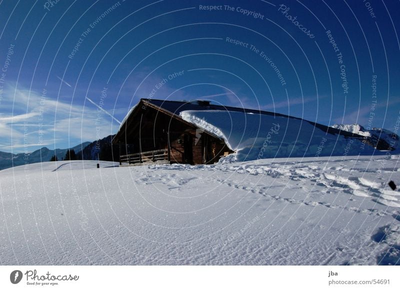 solitary Alpine pasture Agriculture Mountain farmer Wood House (Residential Structure) Barn Roof Snow Winter Ski tour Hut Farmer Glittering Sun Sky Clarity