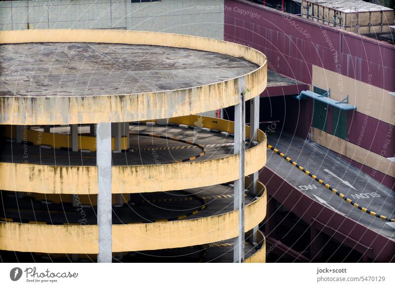 Left-hand traffic in parking garage Parking garage Architecture Weathered Traffic infrastructure Gloomy High plain Subdued colour Parking level Singapore