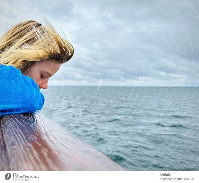 Child standing at the railing of a ferry looking down at the gray Baltic Sea Railing Ferry Ocean Navigation ship voyage Vacation & Travel Water Far-off places