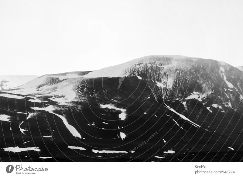 Mountains and hills in Iceland North Iceland Icelandic Rock rock formation rocky Lonely residual snow Snow Nordic somber Dark fabulous silent tranquillity