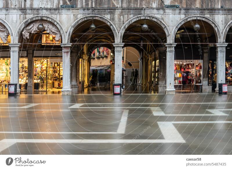 The St. Mark's Square in Venice during Bad Weather and High Tide, Venice venice european passage shops arches long exposure water baroque high tide colonnade