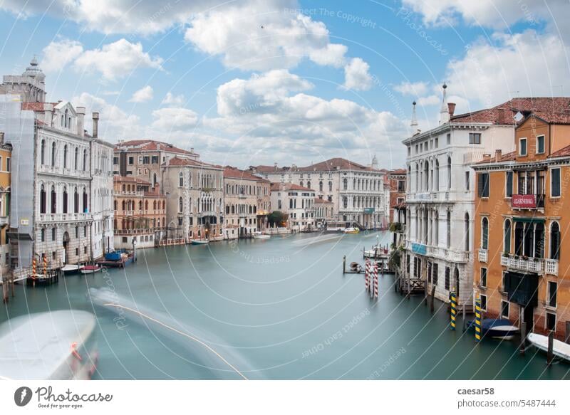 View from famous Canal Grande during a summer day venice canal view scenic scene water river venetian baroque classical sky clouds blue exposure long speed