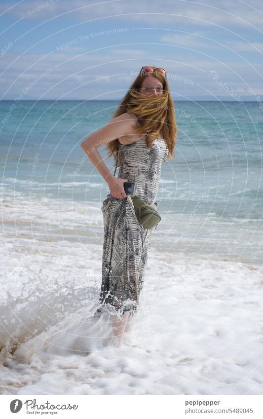 young redhead woman surprised by cold wave Red red hair Redheads Red-haired Woman Feminine Hair and hairstyles Young woman pretty astonished frightened