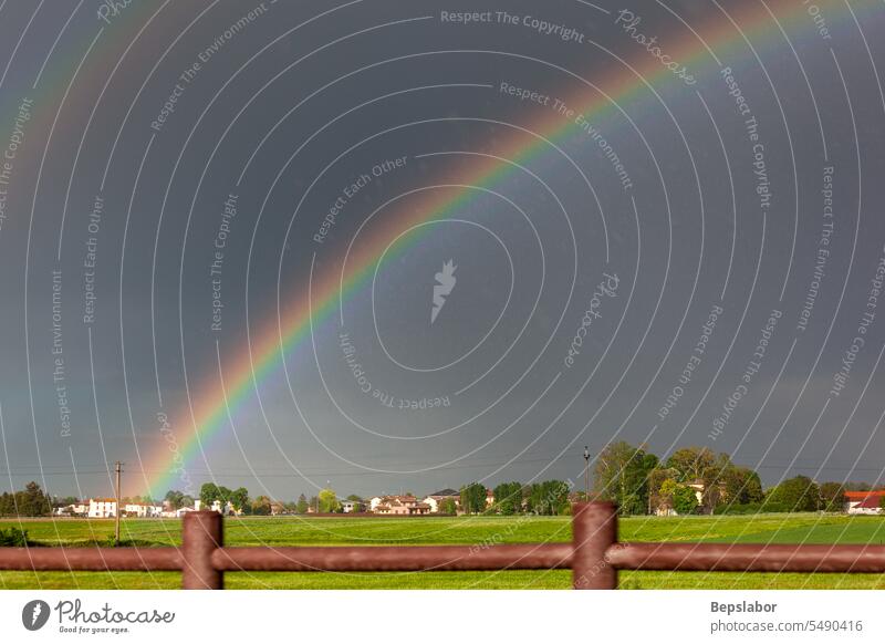 Double rainbow on a beautiful hills scenery in Italy field green nature sky cloud blue europa grass panorama farmland horizon light scenic weather beauty bright