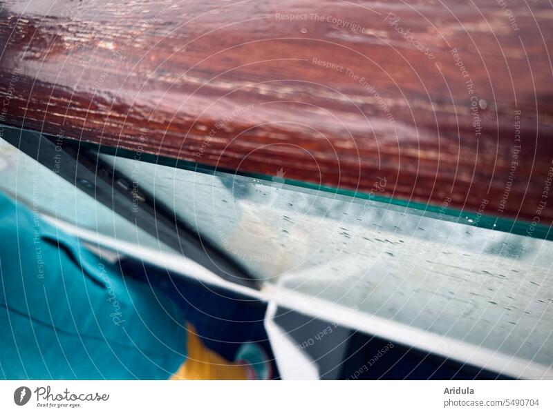 Child standing on the railing of a ferry Ferry Wood handrail Glass Slice raindrops Rain boat Navigation Water Ocean Baltic Sea Vacation & Travel Passenger ship