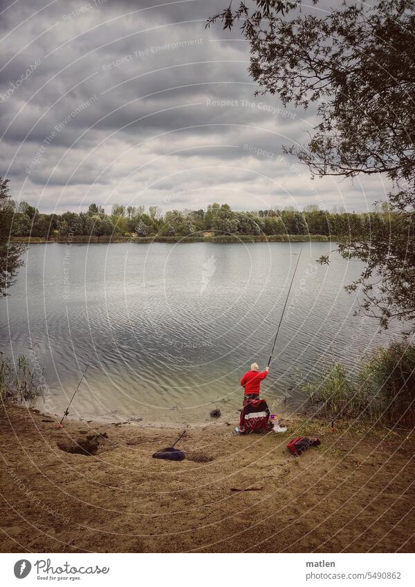 Angler on the lake Lake Clouds Sky trees Gray Red bank Beach Fishing (Angle) Relaxation Calm Leisure and hobbies