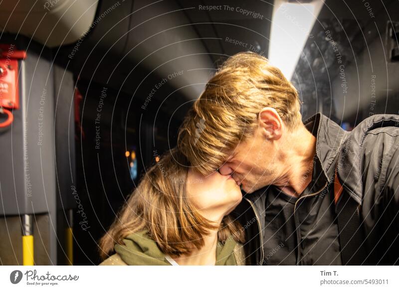 Kissing couple in streetcar Couple Tram Berlin Town Capital city Colour photo Woman Man Couples Prenzlauer Berg Night Interior shot