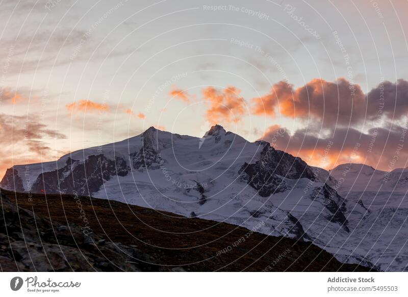 Sunrise at Riffelsee in Switzerland seascape mountain rocky ridge formation winter scenery snow cold freeze idyllic weather season majestic serene nature peak