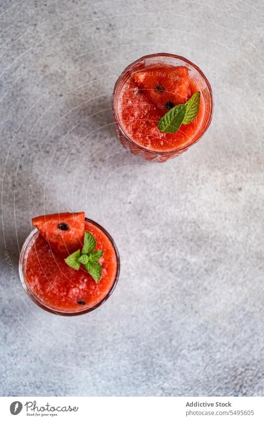 From above Margarita cocktails smoothie watermelon mint hand fresh drink refreshment beverage glass tasty ice cube organic mix delicious fruit slice healthy