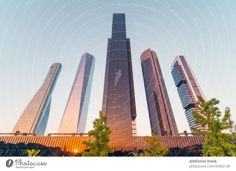 Modern business center with many skyscrapers against blue sky in daylight building facade architecture downtown exterior construction urban structure city