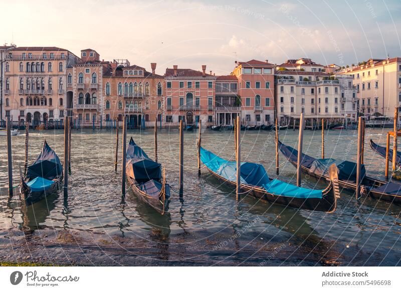 Vessel boats against old buildings in harbor gondola vessel grand canal river ancient breathtaking sunset venice morosini ferro manolesso