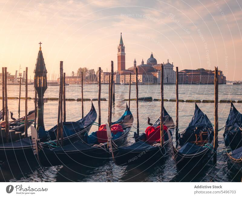 Vessel boats against old buildings in harbor gondola vessel grand canal river ancient breathtaking sunset venice morosini ferro manolesso