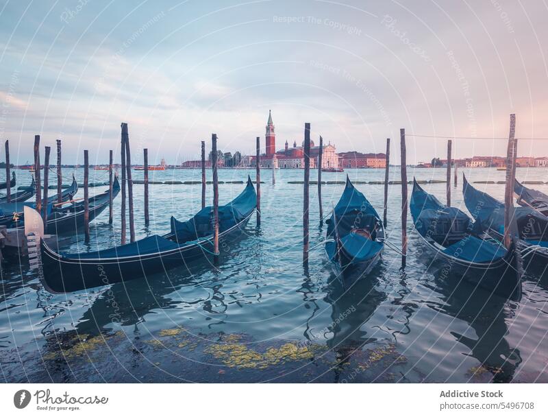 Vessel boats against old buildings in harbor gondola vessel grand canal river ancient breathtaking sunset venice morosini ferro manolesso