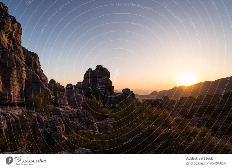 Mountainous terrain with green valley in sunset mountain meadow sierra del torcal wonderful landscape high peak el torcal de antequera malaga spain hill rocky