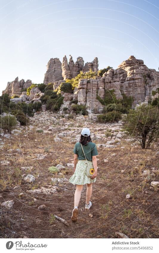 Woman admiring view of rocky terrain woman traveler admire el torcal de antequera mountain spectacular landscape summer weekend female asian sierra del torcal