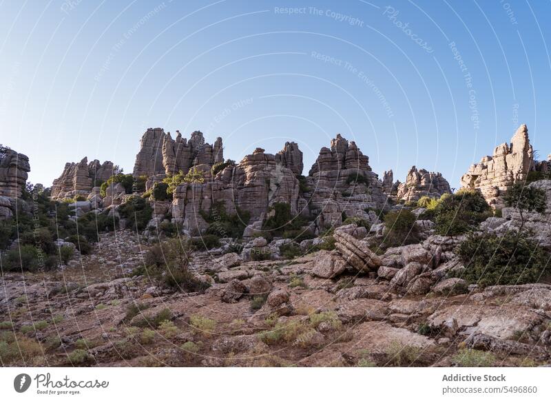 Mountain ridge against clear blue sky in sunset mountain rocky rough el torcal de antequera amazing landscape nature park sierra del torcal malaga spain hill