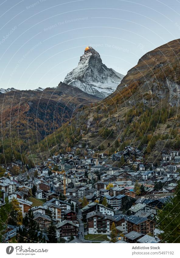 Small village and picturesque mountains under blue skies village and picturesque mountains under blue skies ridge hill highland nature breathtaking Matterhorn