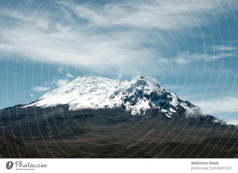 Volcano covered with snow on sunny day volcano ecological reserve landscape environment nature valley cloud antisana ecuador south america picturesque blue sky