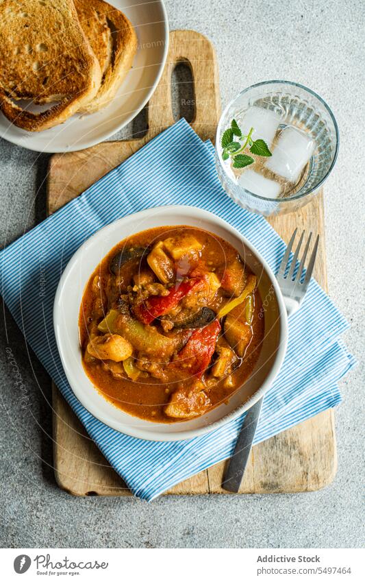 Traditional seasonal Georgian dish - Adjapsandali, is stewed vegetables like potato, bell peppers, tomato, egg plant, coriander and Georgian spices. plate menu