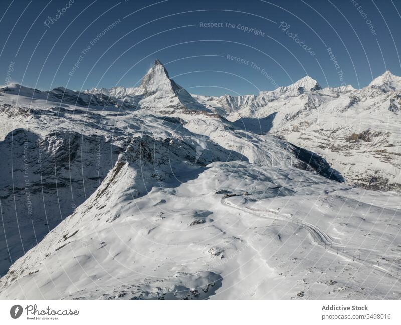 Snowy mountains in winter snow gloomy frozen cold landscape rock nature park coast scenic sky cloudy environment scenery shore ridge range wild dark overcast