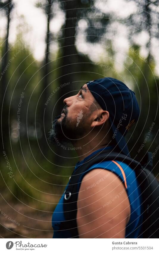 Man walking through the forest, observing his natural environment. Only one man Face of a man Forest Nature Landscape watch 1 Person Exterior shot portrait