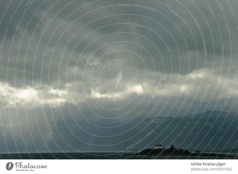 Alaska | lonely lighthouse on the sea way to Juno Lighthouse Sea route Clouds Ocean Sky Dark clouds Landscape coast Vacation & Travel Lonely mountains Sunbeam