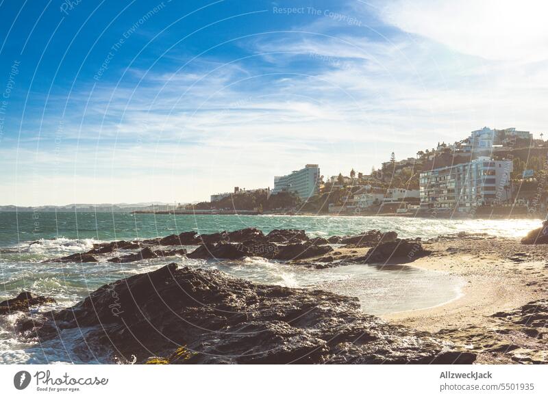 rocky beach section with hotel facilities panorama on the coast of Benalmádena, in Andalusia, Spain Ocean Seashore seaboard Rock Waves Swell coastal landscape