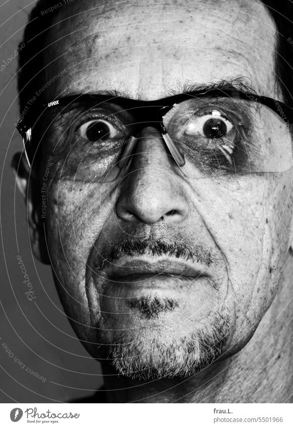 Bicycle goggles with violets Eyeglasses Old portrait Facial hair Face Man Intensive Looking black eye Shock shocked Horror appalled eyes gape haematoma