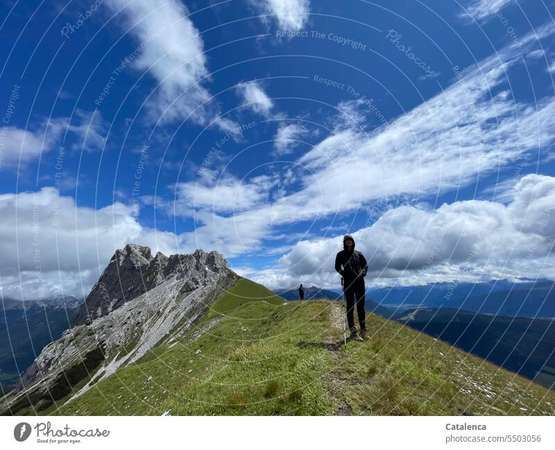 Hiker in alpine landscape daylight Beautiful weather Nature Day Environment Rock Sky mountains Peak Landscape Clouds Alps path hikers Hiking vacation Mountain