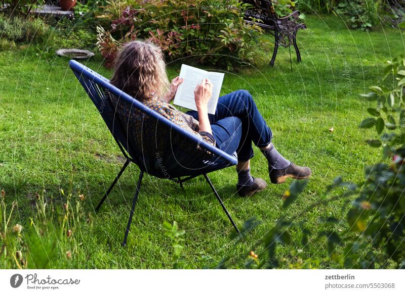 Reading in the garden Tree blossom Blossom Relaxation awakening holidays Garden Hedge allotment Garden allotments bud composite neighbourhood Nature Plant