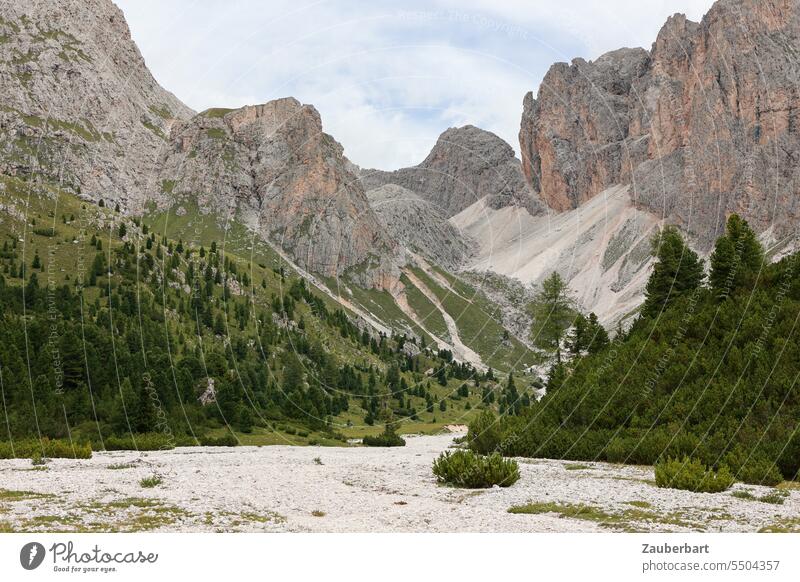 Mountain panorama, dry stream bed, rocks, saddle and boulder field, sky with clouds mountain Alps Peak Clouds Green Landscape South Tyrol Hiking wanderlust