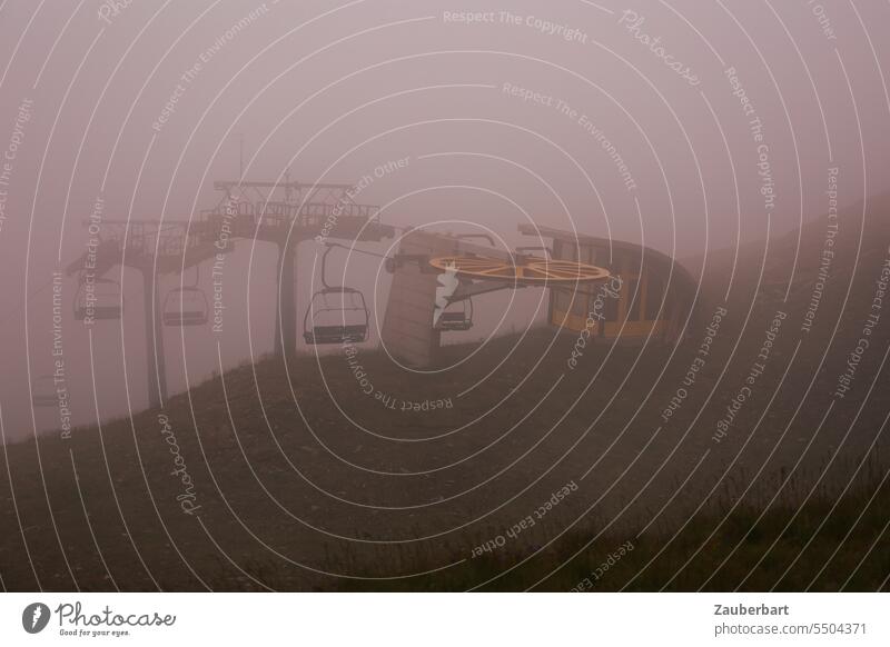 Chairlift top station with empty chairs in fog chair lift Mountain station Fog Empty forsake sb./sth. cloudy Climate climate crisis Snow Tourism Alps skis