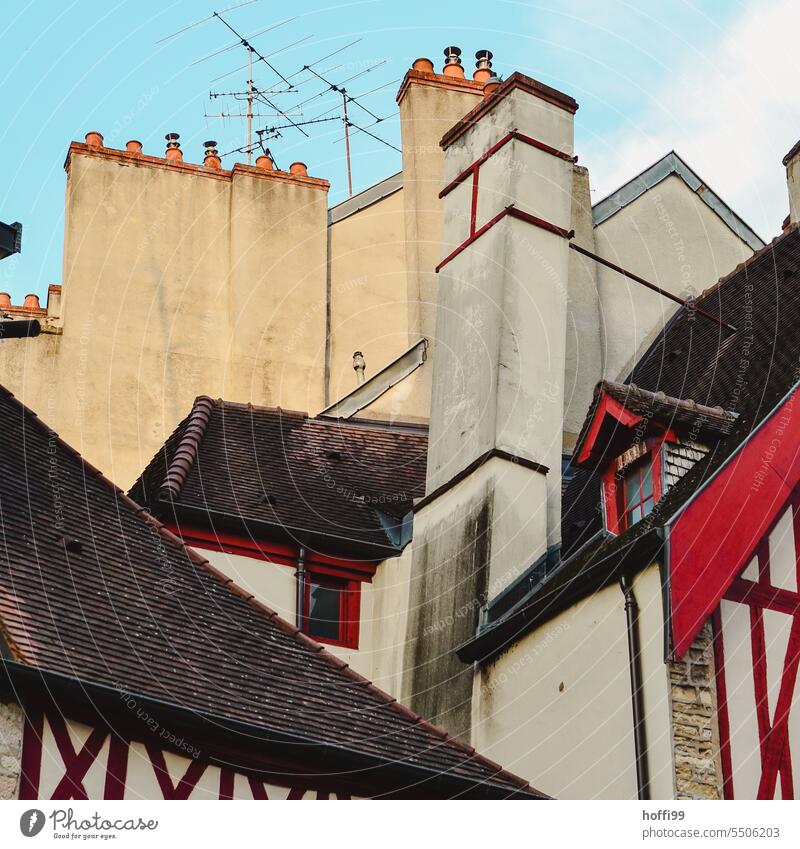 Chimneys and antennas in sweet togetherness - nostalgic moments in a small old town chimneys Fireside Trigger Antenna television aerial Half-timbered house