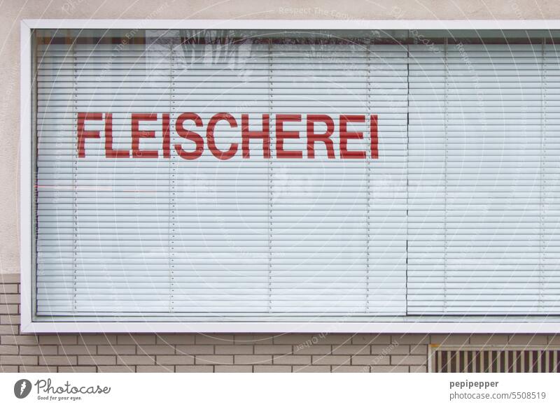 Shop window of a butcher shop with blinds down Butchery Meat Food Nutrition Sausage Deserted Exterior shot Eating Swine Pork Trade Dead animal sausage