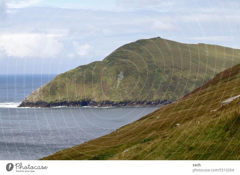 At the end of the world Ireland Hill Grass Meadow Clouds Nature Green Landscape Bad weather Mountain Ocean Atlantic Ocean Atlantic coast Water