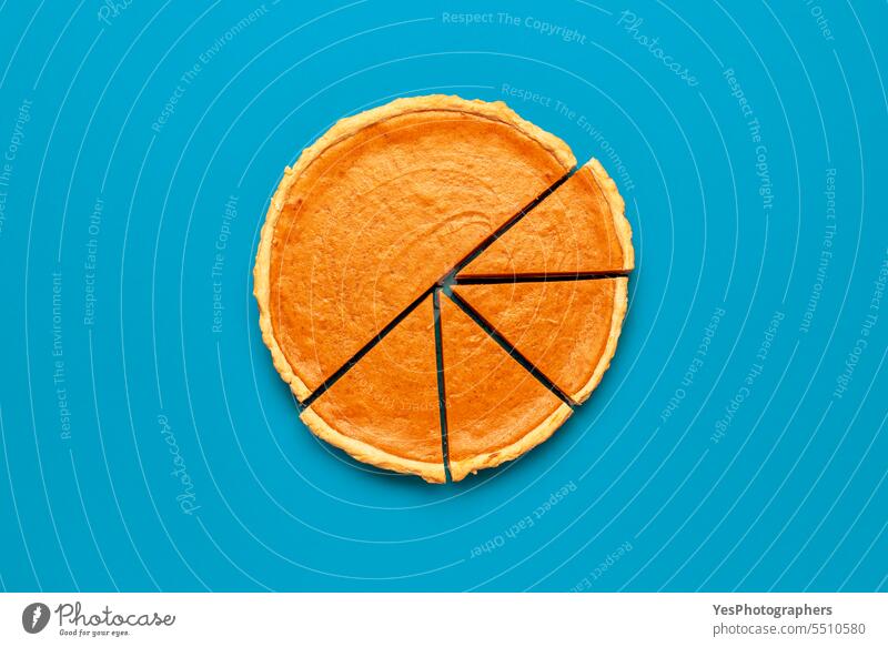 Homemade pumpkin tart minimalist on a blue background Halloween above autumn baking bright brown cake celebration christmas color comfort concept context