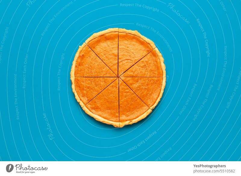 Sliced pumpkin pie, top view on a blue table Halloween above autumn background baking bright brown cake celebration christmas color comfort concept context