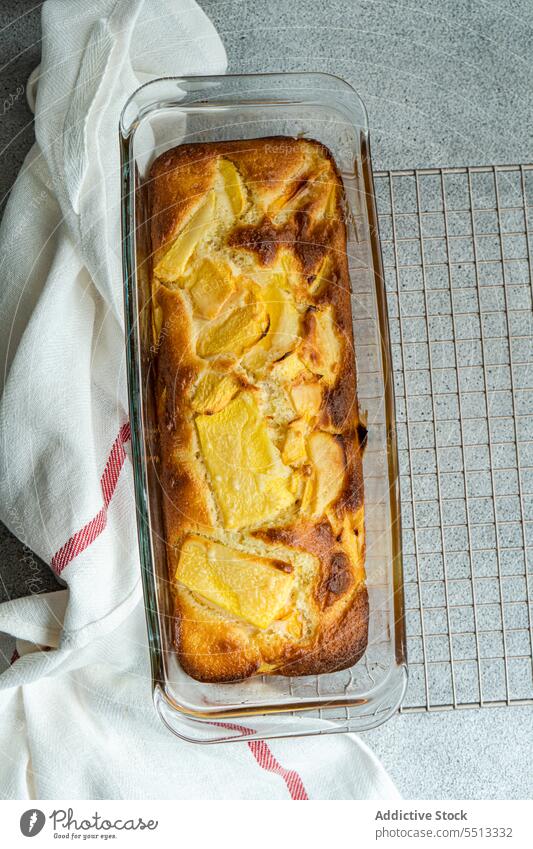 Seasonal peach pie on oven rack seasonal eat food sweet dessert aromatic plate table surface napkin tablecloth high angle piece portion ingredient yummy