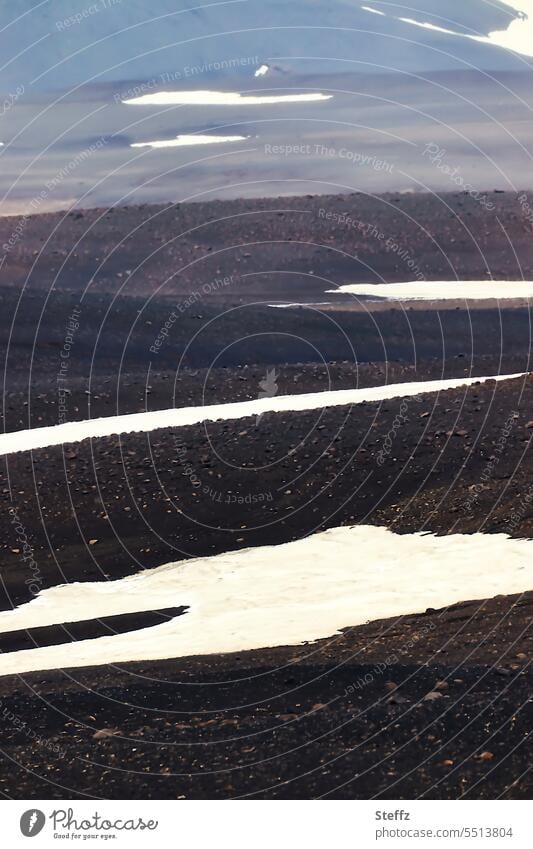 Lava landscape with snow melt on Iceland Icelandic Lava field Volcanic Lava mound Iceland picture Snow forms iceland trip residual snow Snow melt snow stains