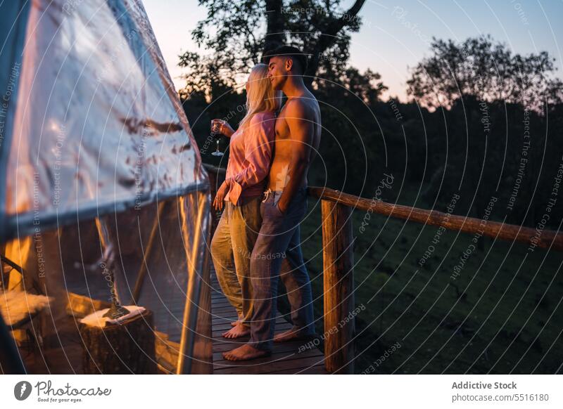 Couple spending time together on terrace man woman couple evening railing enjoy veranda wooden sunset summer relationship calm love romantic affection season