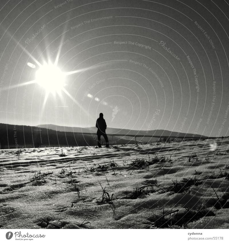 solar tanker Sunbathing Winter Thuringia Field Action Highlands Far-off places Panorama (View) Sky Lighting Warmth Black & white photo Mountain Snow Human being