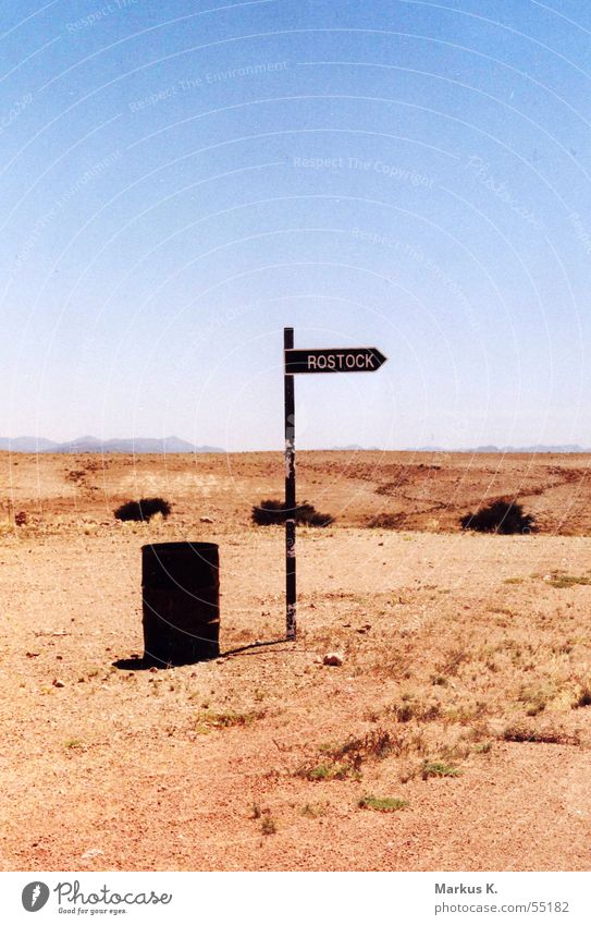 Rostock? Keg Namibia Funny Strange Hot Physics Dry Globalization Desert Empty nowhere somewhere Signs and labeling Road marking Namib desert Bird's colony