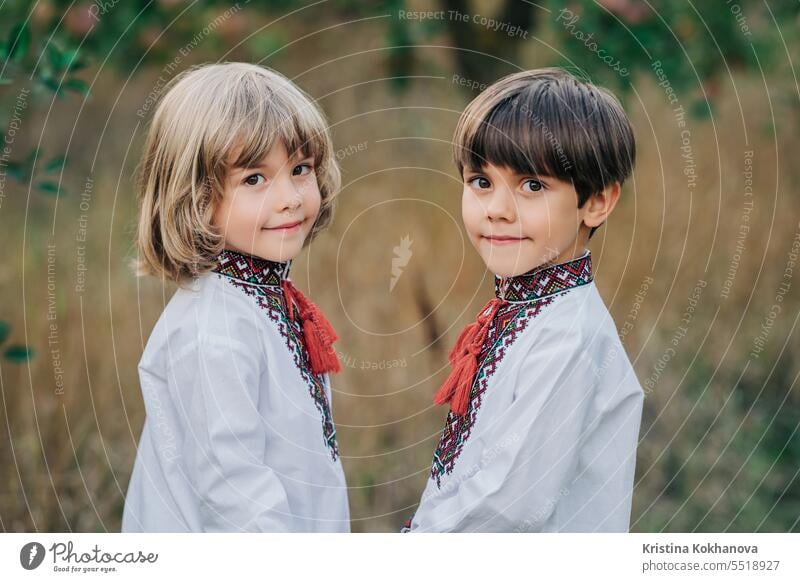 Portrait handsome ukrainian boys apple orchard. Children traditional embroidery happiness kid summer ukraine field happy background brothers childhood children