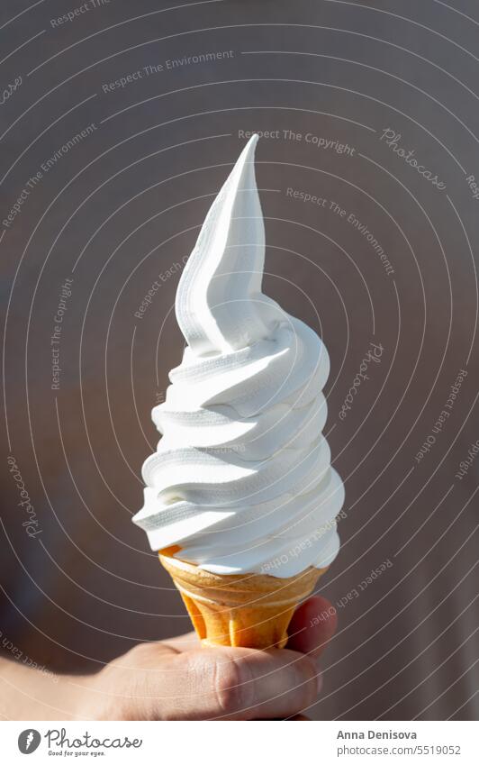 Soft vanilla ice cream with chocolate stick soft cone hand whippy soft ice cream takeaway treat confectionery creamy whipped whipper cornet milk icecream tasty