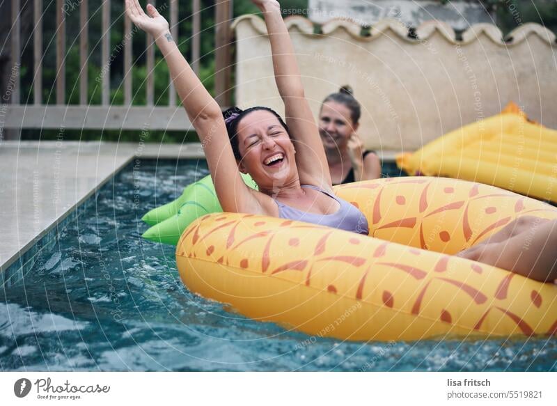 BATHING FUN - POOL PARTY - EXUBERANT pool party bathing fun Woman 25 to 30 years girlfriends Friendship muck about Joy Water Floating tyres bathe Funny women