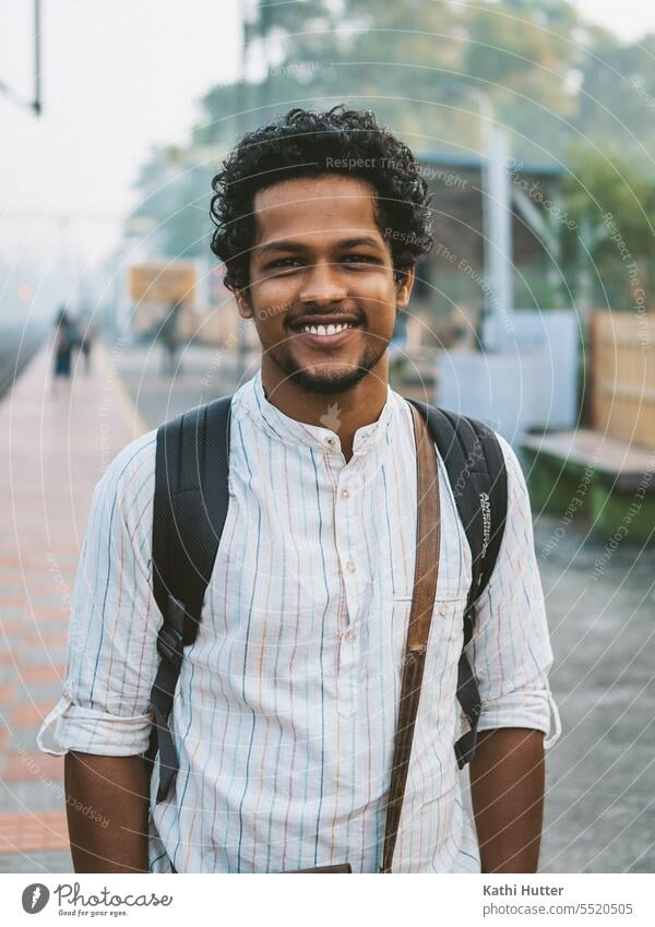 a young man at the train station on his way to work Man Train station travel Commute City Vacation & Travel Modern Work and employment Lifestyle Town Business