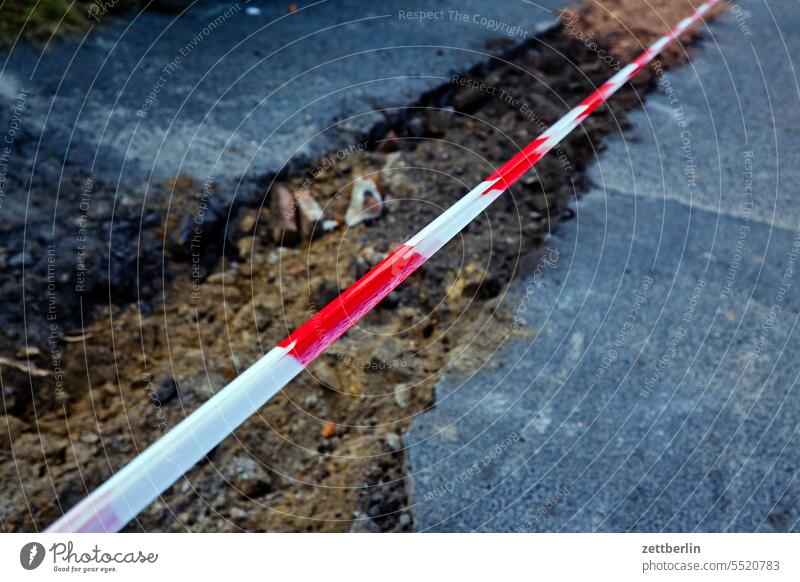 Flutter tape over a crevice in the asphalt Old building Architecture on the outside construction construction industry construction sector Construction site