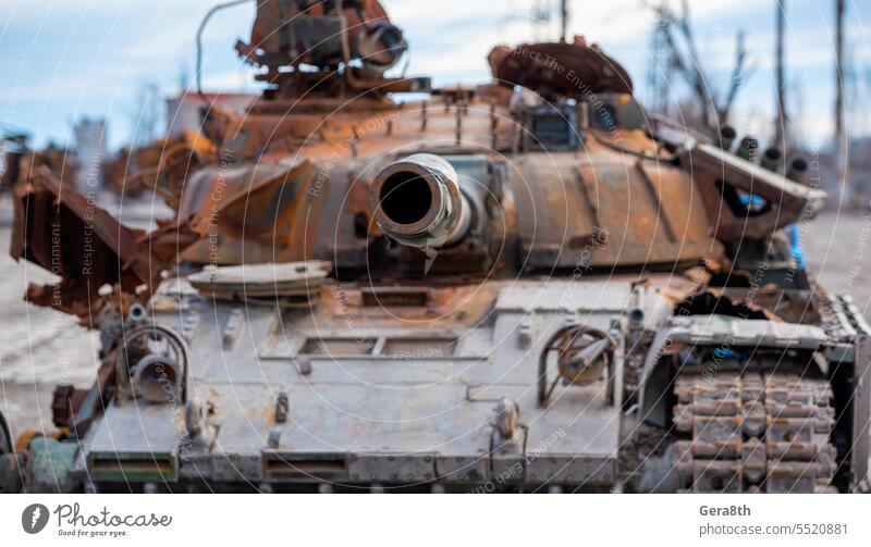 damaged military tank on a city street in Ukraine Donetsk Kherson Lugansk Mariupol Russia Zaporozhye abandon abandoned armor attack bakhmut blown up bombardment