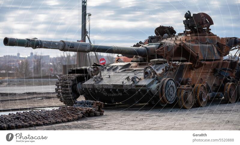 damaged military tank on a city street in Ukraine Donetsk Kherson Lugansk Mariupol Russia Zaporozhye abandon abandoned armor attack bakhmut blown up bombardment