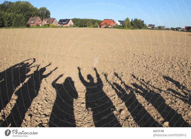 shadow theatre Landscape Marginal phenomenon shadow cast Group Connectedness long shadows silhouettes Body Arm hands Shadow play Light and shadow